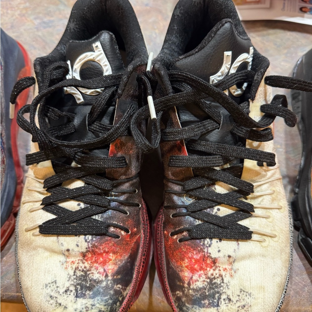 Nike Black and Red Athletic Shoes with Distinctive Design